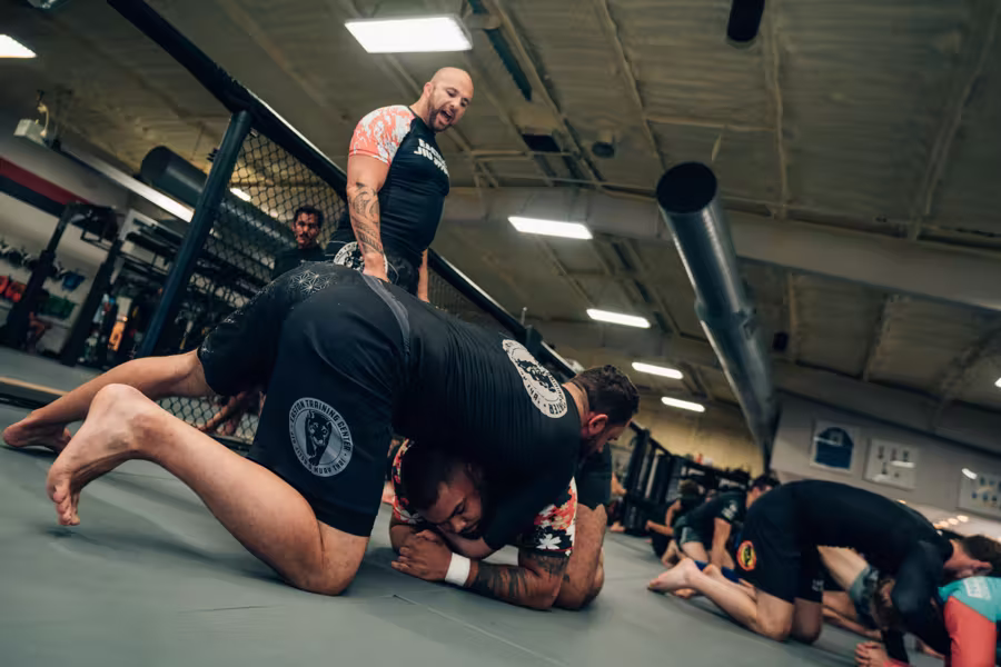 Coach watching a no-gi exchange up close