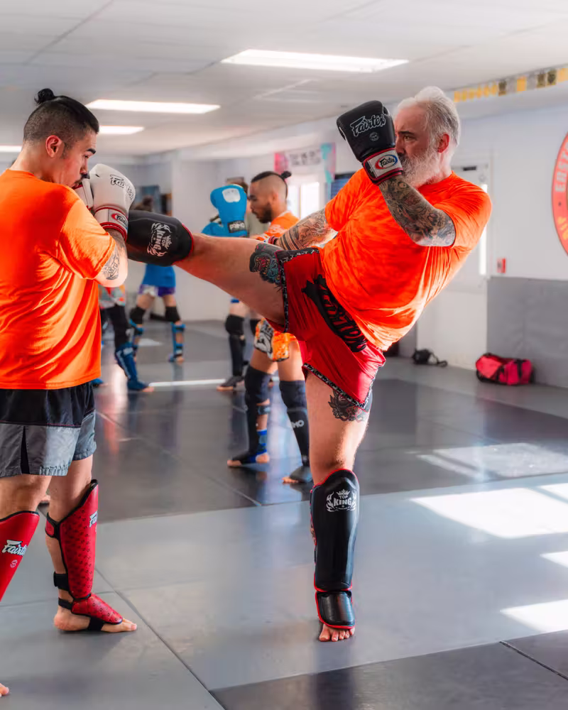 Roundhouse kicks during Muay Thai class at Easton Littleton