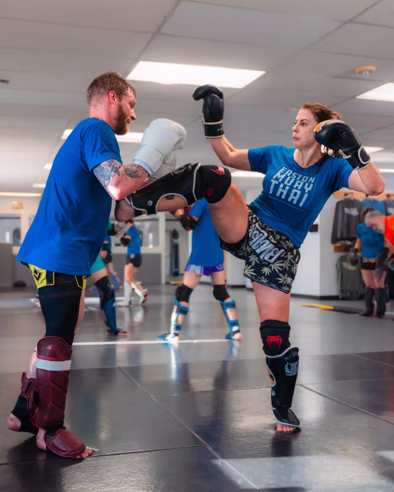 Pad work in Muay Thai class at Easton Littleton