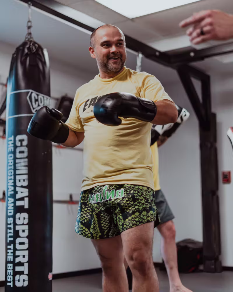 Muay Thai coach working with a student at Easton Littleton