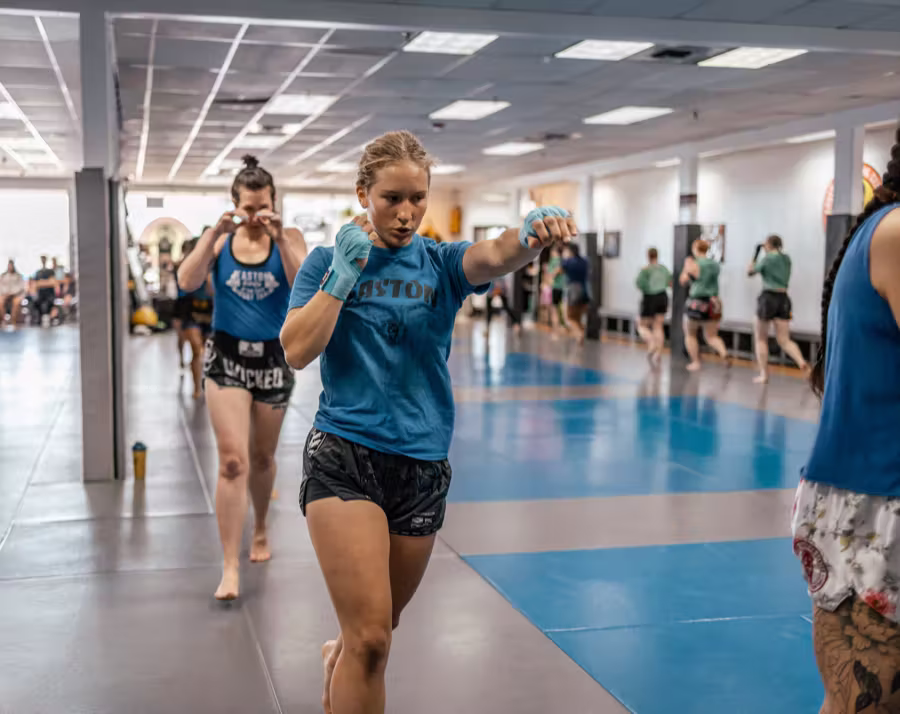 A woman shadowboxing in an Easton kickboxing class