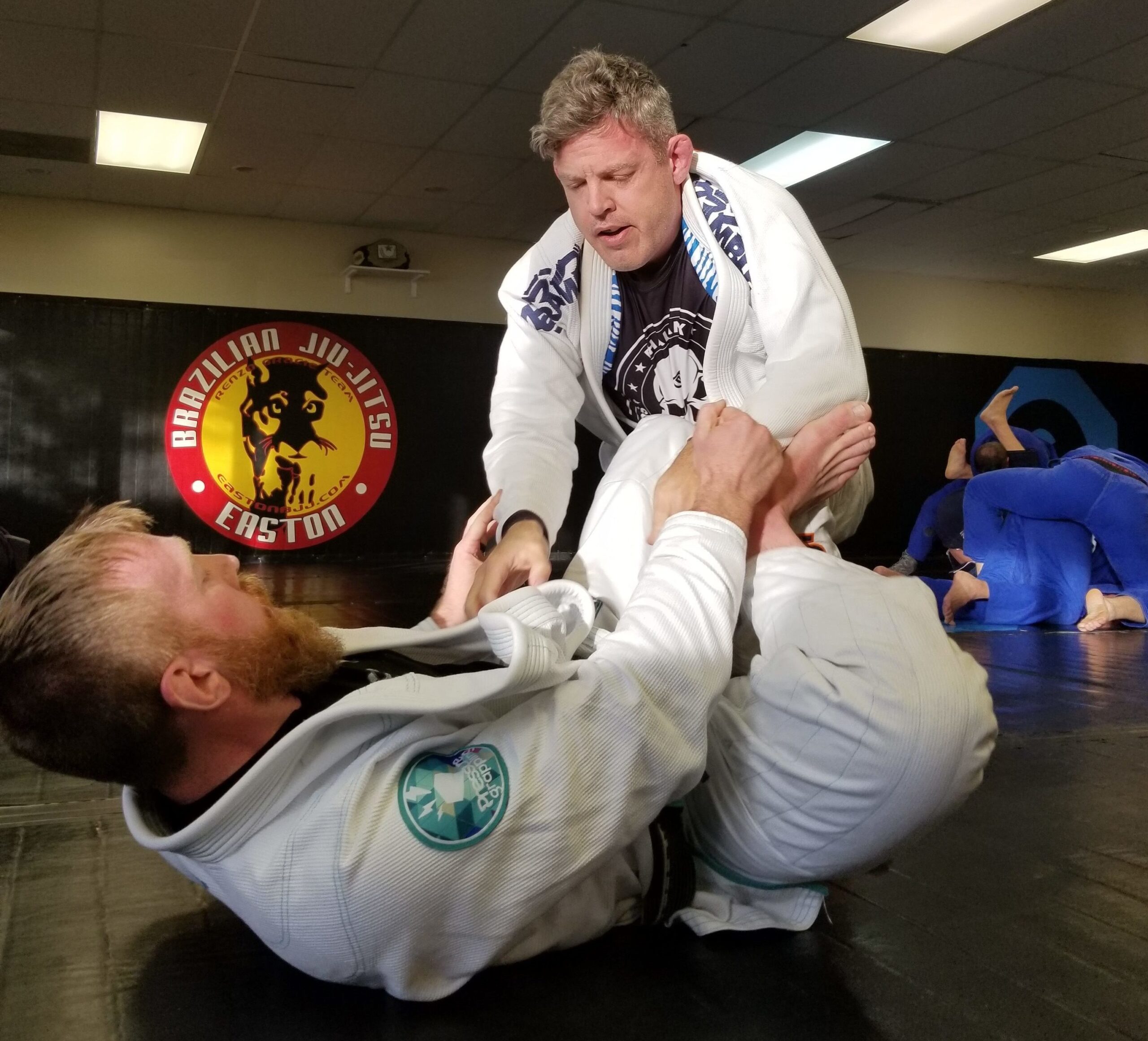 An image of two men training Brazilian Jiu-Jitsu at Easton Training Center in Colorado