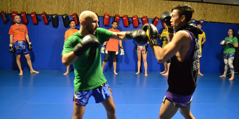 Coach Matt Bloss demonstrates technique in Muay Thai class at Easton Arvada