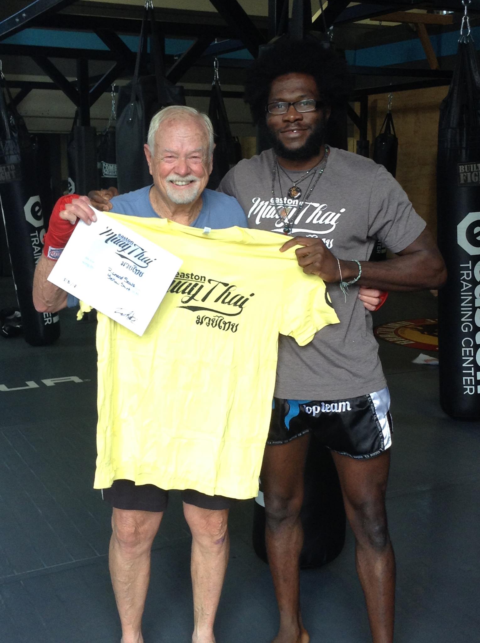 Easton Muay Thai student Richard Seals poses with coach Terrence Moore.