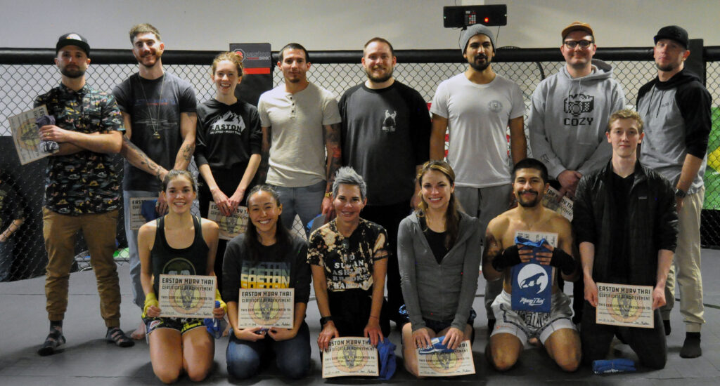 A group of Easton Muay Thai students who earned rank promotions at the Winter Muay Thai Smoker.