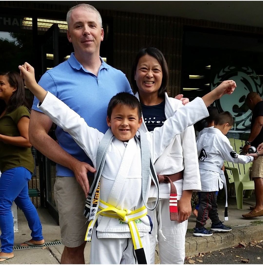 The Lam-Wright family at Nathan's promotion to yellow-white belt.