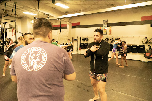 An image of Coach Sean Madden, teaching a Muay Thai class at Easton Training Center in Denver.