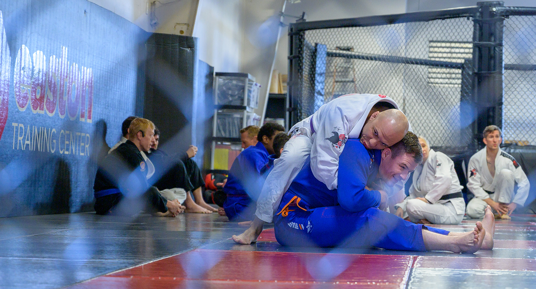 Two adults practicing Brazilian Jiu-JItsu at Easton Training Center in Denver, Colorado.