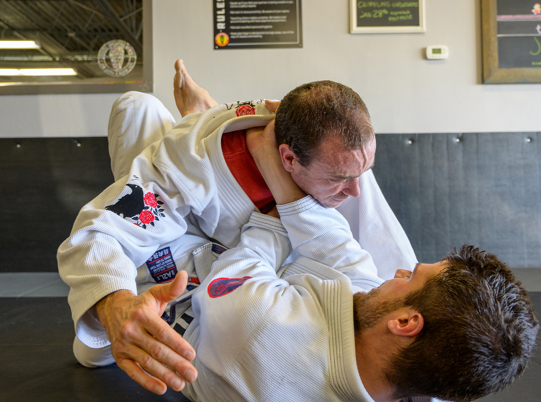 An image of two adults practicing Brazilian Jiu-Jitsu in Littleton at Easton Training Center.