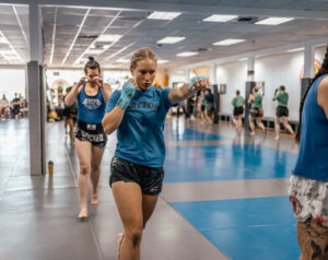 women shadowboxing in a Muay Thai class