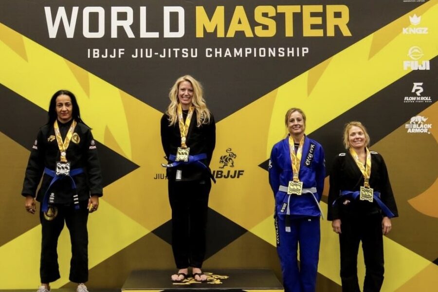 Tyra Pritt on the podium winning a gold medal at the World Master IBJJF Jiu Jitsu Championship