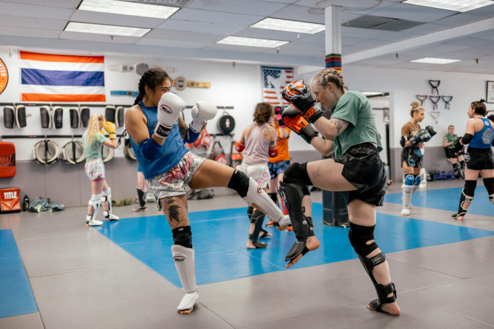 women in a muay thai sparring event