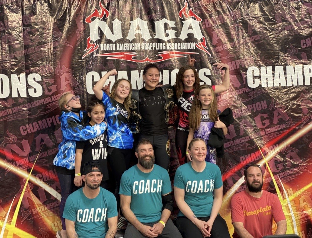 Easton Littleton kids competitors with coaches at a NAGA tournament