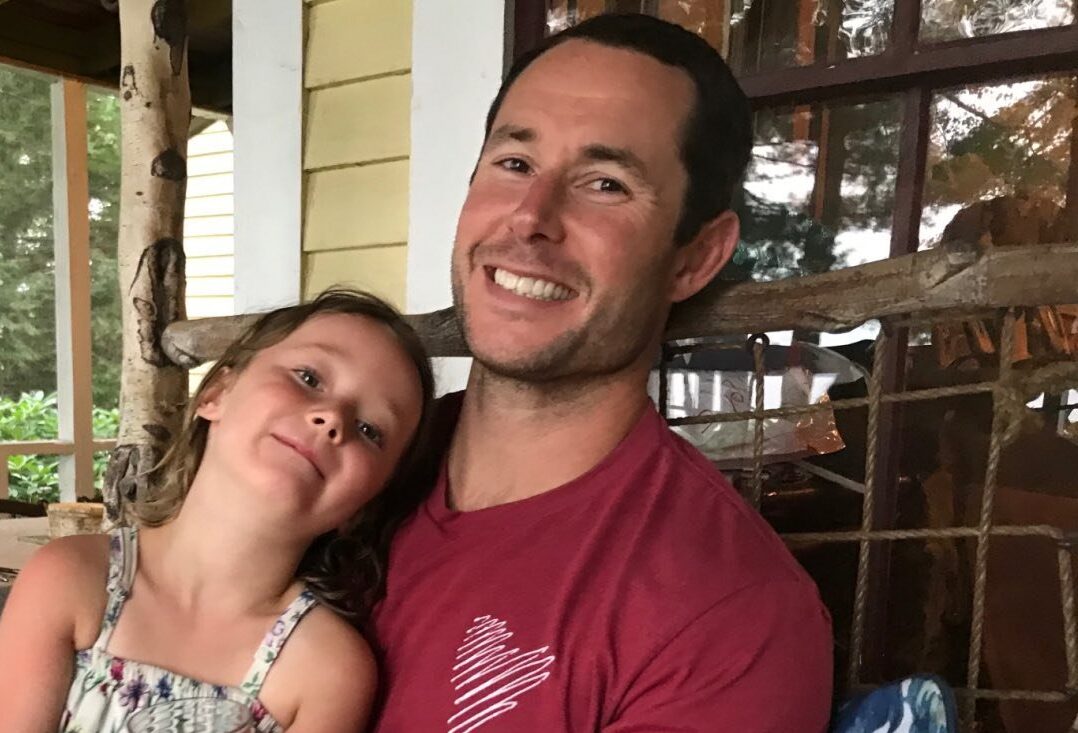 PT Matt Smith sits with his daughter in his lap