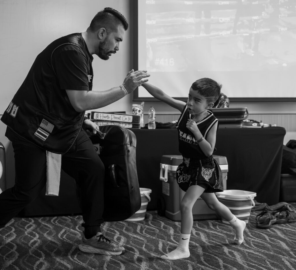 Sean Madden training a small boy in Muay Thai