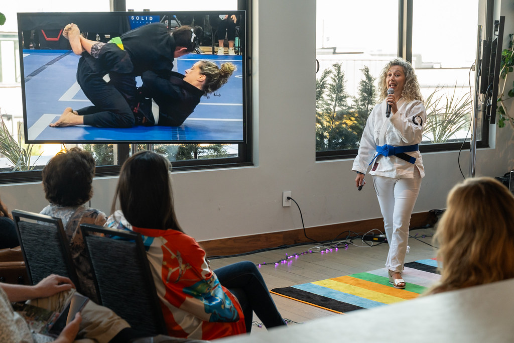 Marta Spirk speaks at a Creative Mornings Denver event about Jiu Jitsu and performing under pressure