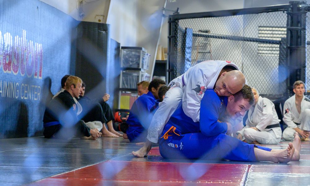 Two adults practicing Brazilian Jiu-JItsu at Easton Training Center in Denver, Colorado.