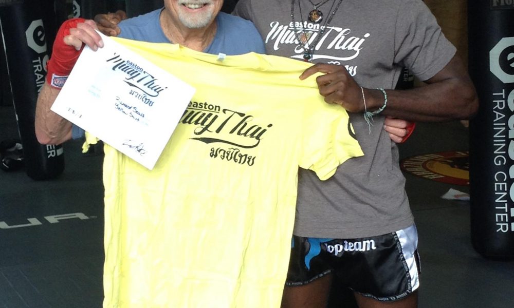 Easton Muay Thai student Richard Seals poses with coach Terrence Moore.