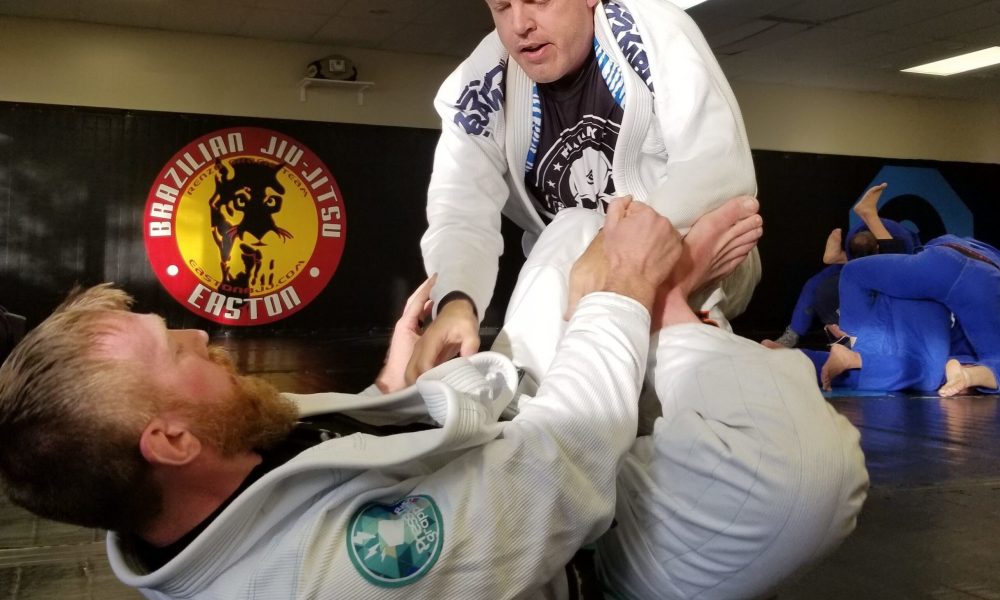An image of two men training Brazilian Jiu-Jitsu at Easton Training Center in Colorado