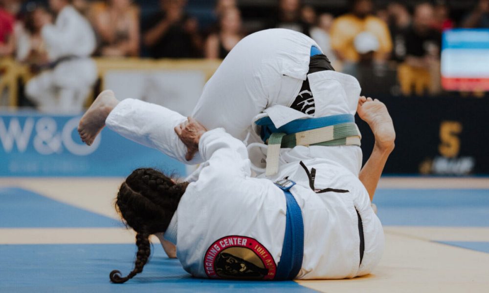 A blue belt woman in an Easton gi competes at the IBJJF Denver Open