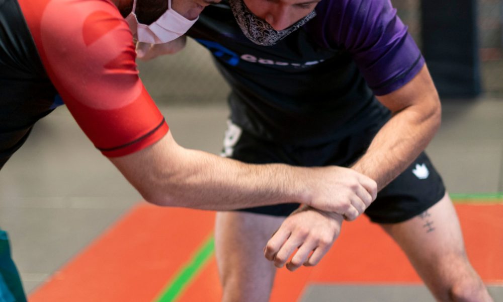 peter carlos mask no gi bjj two men in jiu jitsu rash guards and surgical masks