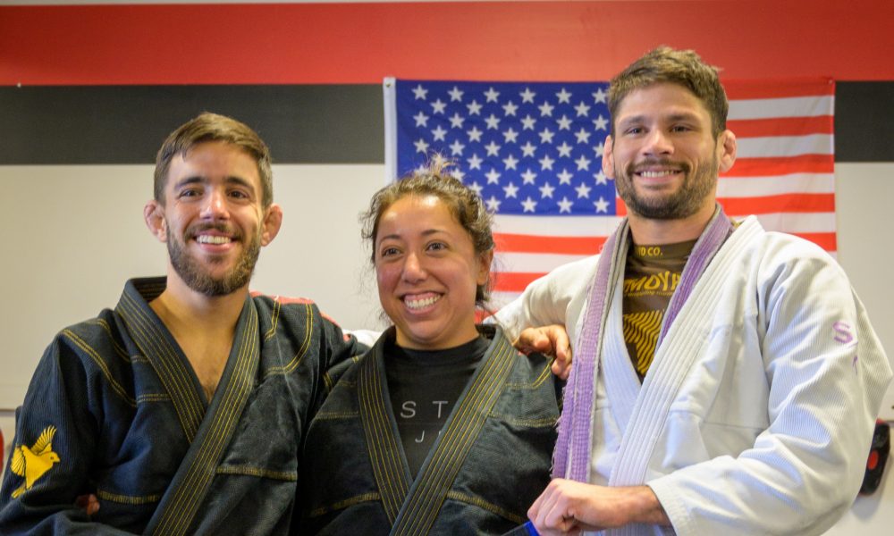 a group of martial arts students pose for a photo