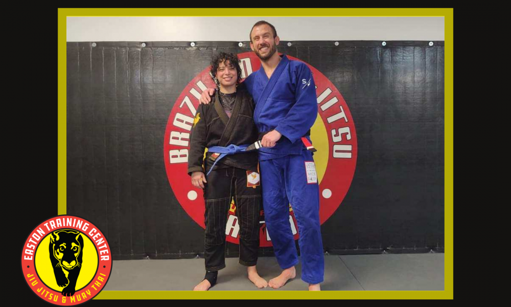 bjj blue belt poses with bjj black belt instructor
